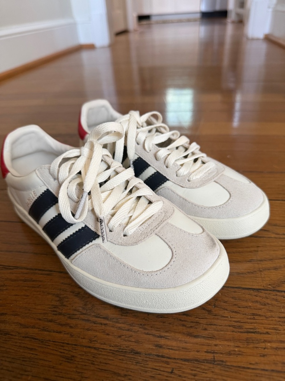 adidas Off-White Suede Sneakers with Black Stripes and Red Heel Tab